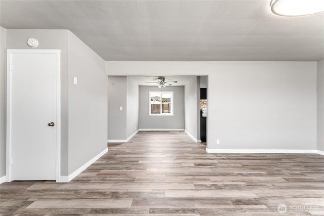 1819 Springwater Ave, Wenatchee, WA 98801 - unfurnished room with ceiling fan, wood finished floors, baseboards, and a smoke detector