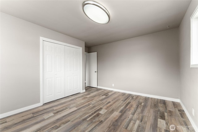 1819 Springwater Ave, Wenatchee, WA 98801 - unfurnished bedroom featuring baseboards, wood finished floors, and a closet
