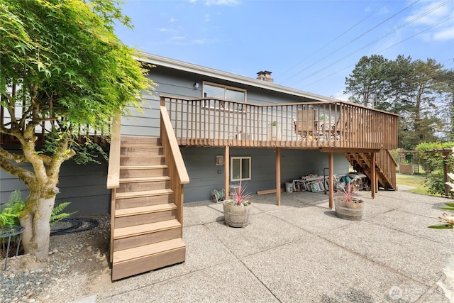 11242 Fremont Ave N Unit B, Seattle, WA 98133 - back of house featuring stairs, a patio area, a wooden deck, and fence