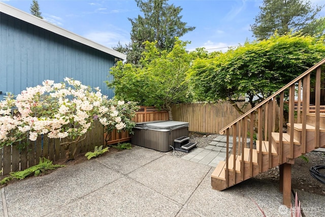 11242 Fremont Ave N Unit B, Seattle, WA 98133 - view of patio with a hot tub, fence, and stairs