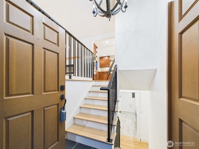 11242 Fremont Ave N Unit B, Seattle, WA 98133 - foyer entrance with a chandelier, stairway, recessed lighting, and wood finished floors