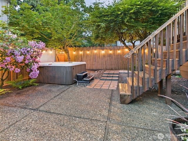11242 Fremont Ave N Unit B, Seattle, WA 98133 - fenced backyard featuring a hot tub and a patio