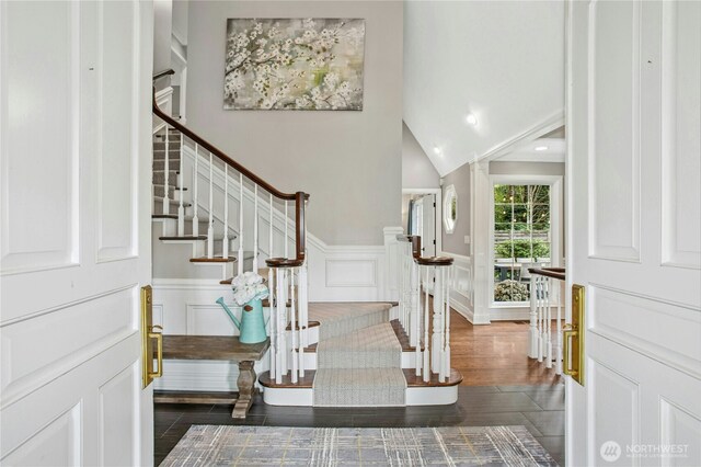 8150 Evergreen Ln, Mercer Island, WA 98040 - entrance foyer featuring stairway, wainscoting, wood finished floors, and a decorative wall