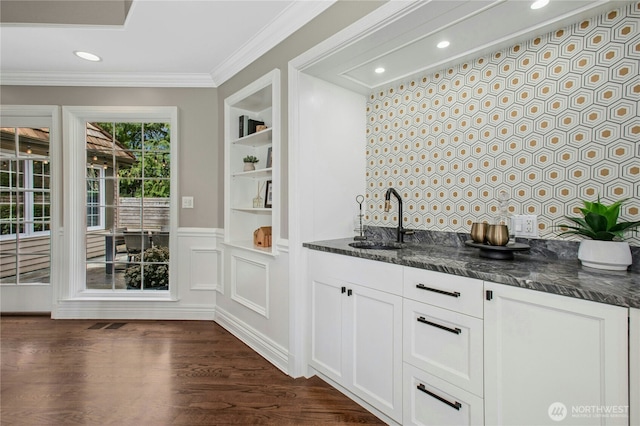8150 Evergreen Ln, Mercer Island, WA 98040 - indoor wet bar featuring ornamental molding, built in features, recessed lighting, and dark wood finished floors