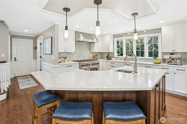 8150 Evergreen Ln, Mercer Island, WA 98040 - kitchen featuring wall chimney exhaust hood, double oven range, a sink, light stone counters, and white cabinets