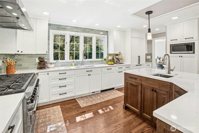 8150 Evergreen Ln, Mercer Island, WA 98040 - kitchen with wall chimney exhaust hood, a sink, built in microwave, stainless steel range, and recessed lighting