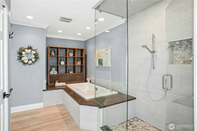 8150 Evergreen Ln, Mercer Island, WA 98040 - bathroom with a shower stall, crown molding, a garden tub, wood finished floors, and recessed lighting