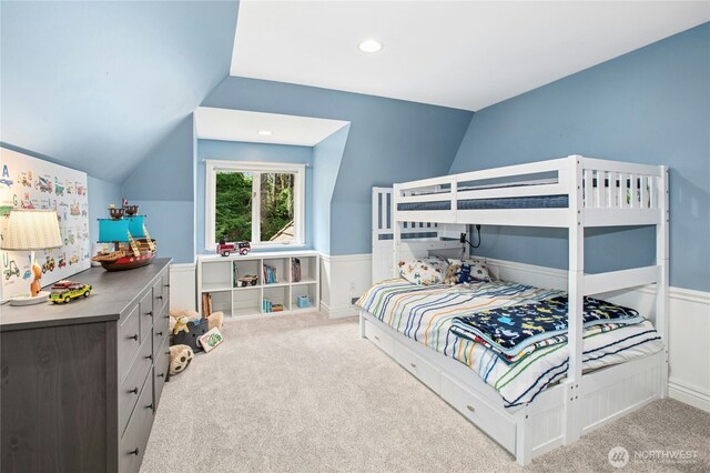 8150 Evergreen Ln, Mercer Island, WA 98040 - carpeted bedroom featuring vaulted ceiling, wainscoting, and recessed lighting