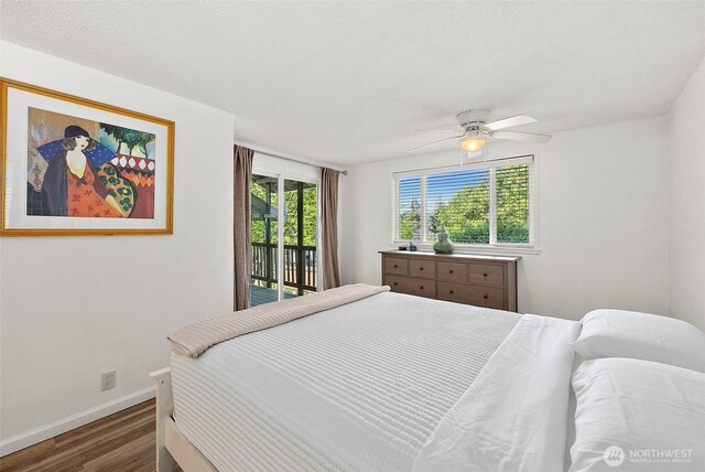 1812 5th St SE, Puyallup, WA 98372 - bedroom with access to exterior, wood finished floors, baseboards, and a ceiling fan