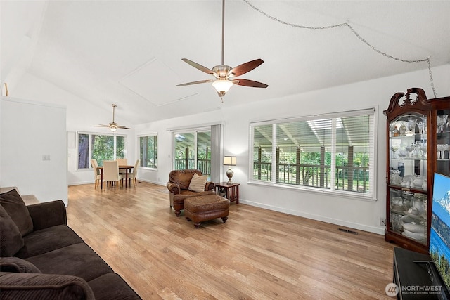 1812 5th St SE, Puyallup, WA 98372 - living room featuring a ceiling fan, lofted ceiling, light wood finished floors, attic access, and baseboards