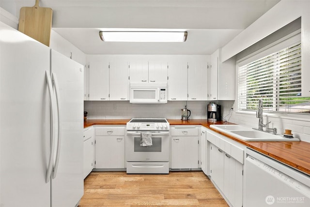 1812 5th St SE, Puyallup, WA 98372 - kitchen with white appliances, a sink, decorative backsplash, and light wood-style floors