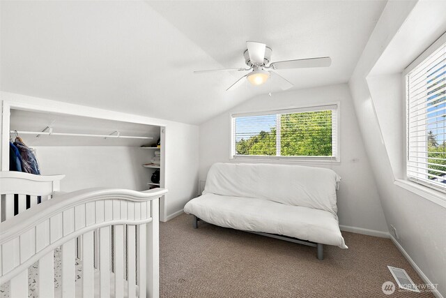 1812 5th St SE, Puyallup, WA 98372 - carpeted bedroom with baseboards, vaulted ceiling, and a ceiling fan