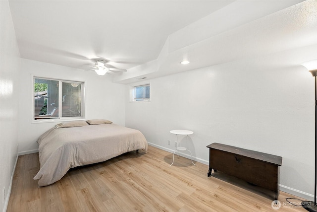 1812 5th St SE, Puyallup, WA 98372 - bedroom with multiple windows, light wood-type flooring, baseboards, and a ceiling fan