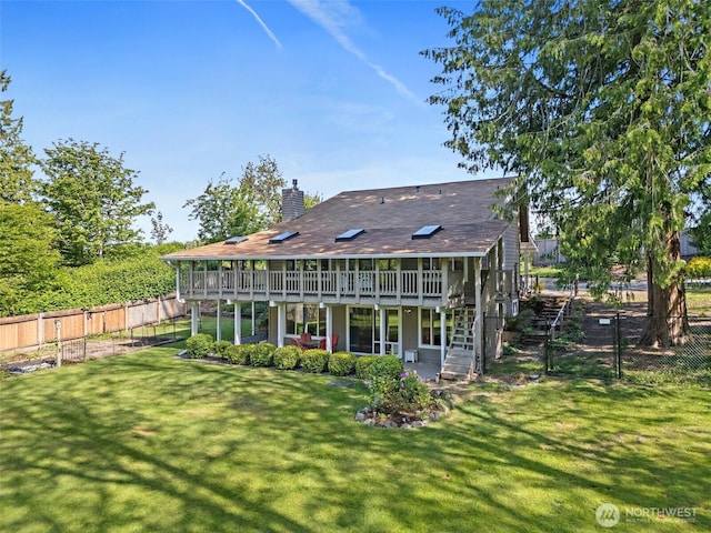 1812 5th St SE, Puyallup, WA 98372 - rear view of house featuring a wooden deck, a chimney, a patio area, and stairs