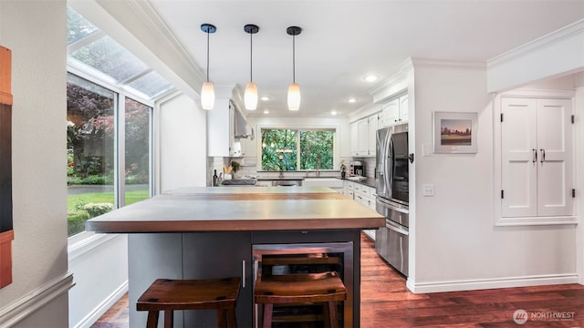 4017 239th Pl SE, Sammamish, WA 98029 - kitchen with stainless steel refrigerator with ice dispenser, ornamental molding, white cabinetry, beverage cooler, and backsplash