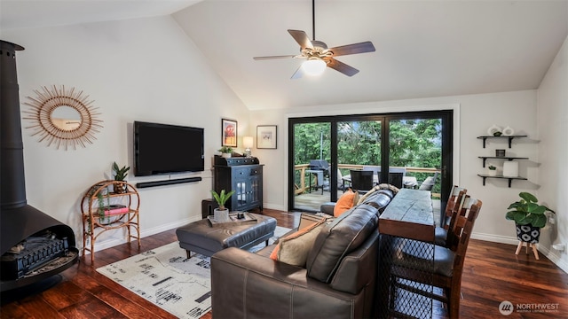 4017 239th Pl SE, Sammamish, WA 98029 - living area with a wood stove, ceiling fan, wood finished floors, baseboards, and high vaulted ceiling