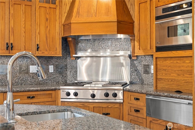 4155 212th Way SE, Sammamish, WA 98075 - kitchen with a warming drawer, appliances with stainless steel finishes, tasteful backsplash, and brown cabinets