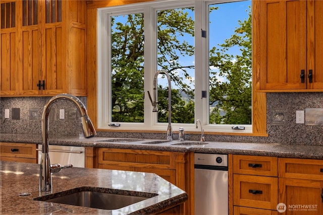 4155 212th Way SE, Sammamish, WA 98075 - kitchen featuring brown cabinetry, tasteful backsplash, dark stone countertops, and a sink