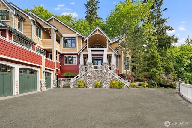 4155 212th Way SE, Sammamish, WA 98075 - view of front of home featuring stone siding, asphalt driveway, stairs, and an attached garage