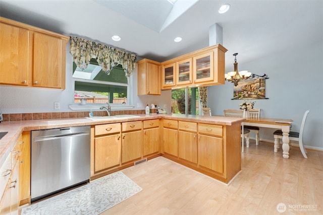 10016 197th St E Unit 88, Graham, WA 98338 - kitchen featuring stainless steel dishwasher, a sink, a peninsula, recessed lighting, and a chandelier