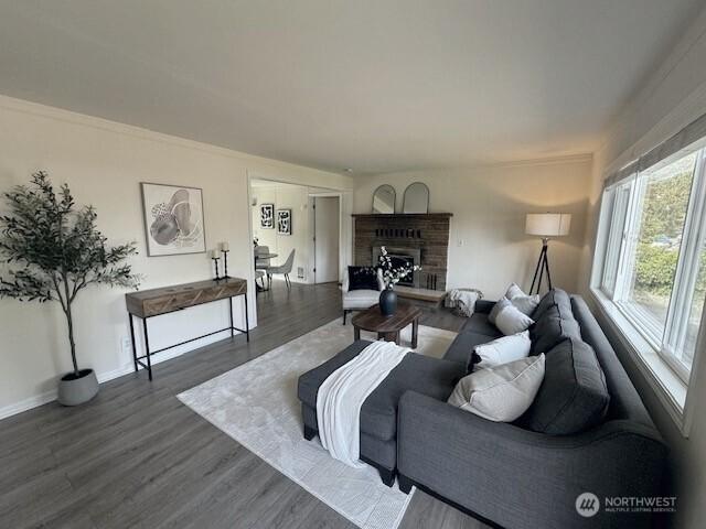 11519 SE 169th St, Renton, WA 98055 - living room with dark wood-style floors and a fireplace with raised hearth