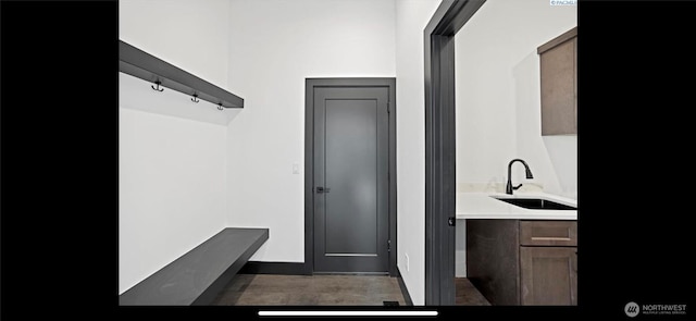3312 Bing St, West Richland, WA 99353 - mudroom featuring a sink, wood finished floors, and baseboards