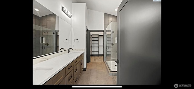 3312 Bing St, West Richland, WA 99353 - bathroom featuring a shower stall, double vanity, and recessed lighting