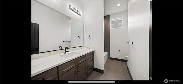 3312 Bing St, West Richland, WA 99353 - full bath featuring toilet, vanity, a bath, and baseboards