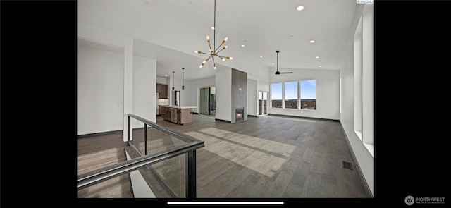 3312 Bing St, West Richland, WA 99353 - unfurnished living room featuring a chandelier, recessed lighting, baseboards, and wood finished floors