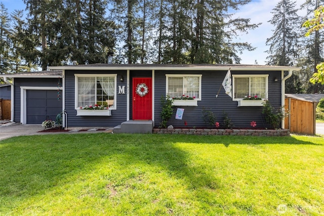 ranch-style home with a front yard, asphalt driveway, and a garage