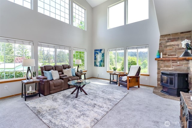 2507 Green Ct SW, Olympia, WA 98512 - carpeted living area featuring a high ceiling, baseboards, and a wood stove