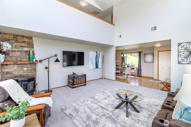 2507 Green Ct SW, Olympia, WA 98512 - carpeted living area featuring a wood stove and baseboards