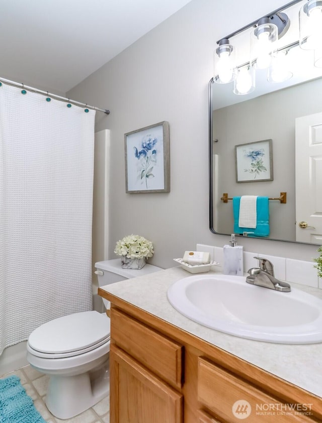 2507 Green Ct SW, Olympia, WA 98512 - full bath with vanity, toilet, tile patterned flooring, and a shower with curtain