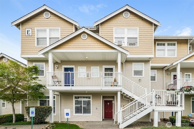 5400 Harbour Pointe Blvd Unit E102, Mukilteo, WA 98275 - townhome / multi-family property featuring stairway and a balcony