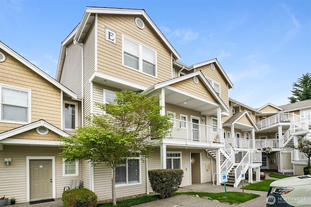 5400 Harbour Pointe Blvd Unit E102, Mukilteo, WA 98275 - townhome / multi-family property featuring stairway and covered porch