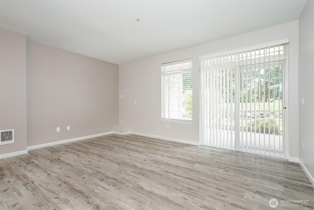 5400 Harbour Pointe Blvd Unit E102, Mukilteo, WA 98275 - empty room featuring wood finished floors and baseboards