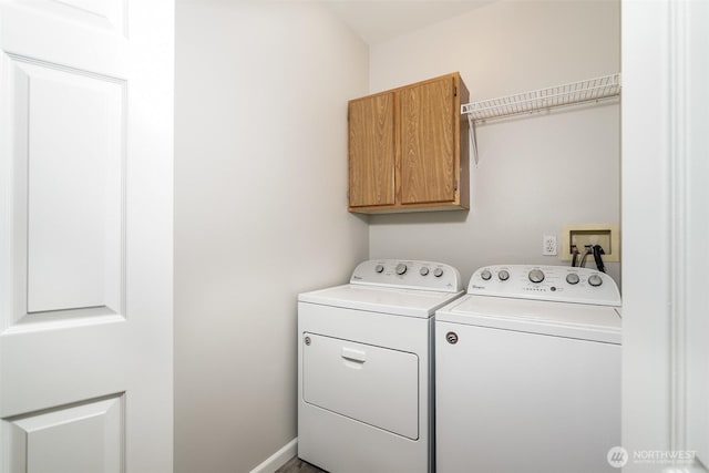 5400 Harbour Pointe Blvd Unit E102, Mukilteo, WA 98275 - laundry room featuring cabinet space and washing machine and dryer