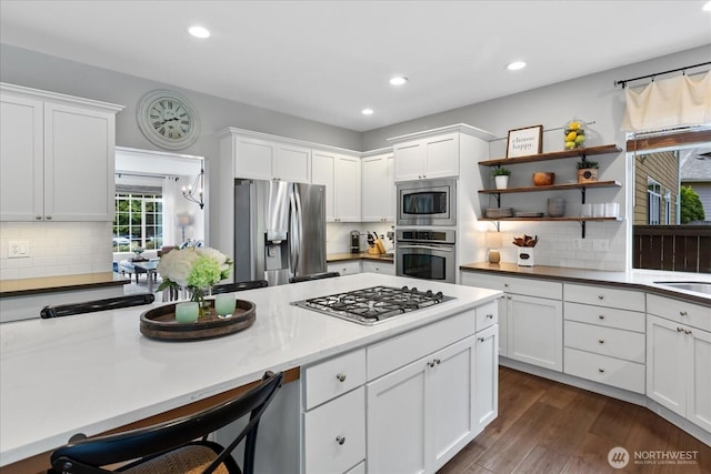 kitchen featuring appliances with stainless steel finishes, white cabinets, recessed lighting, open shelves, and dark wood-style flooring