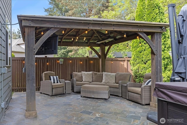 view of patio / terrace with a fenced backyard, a gazebo, and outdoor lounge area