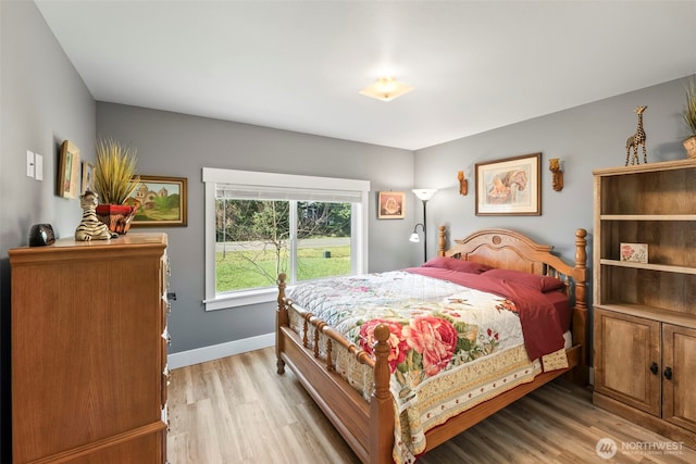 626 Duck Lake Dr SE, Ocean Shores, WA 98569 - bedroom with light wood-style flooring and baseboards