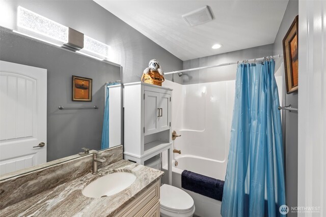 626 Duck Lake Dr SE, Ocean Shores, WA 98569 - bathroom with shower / bathtub combination with curtain, toilet, and vanity