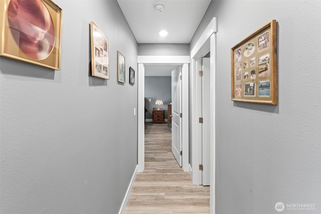 626 Duck Lake Dr SE, Ocean Shores, WA 98569 - hallway with light wood-style flooring and baseboards