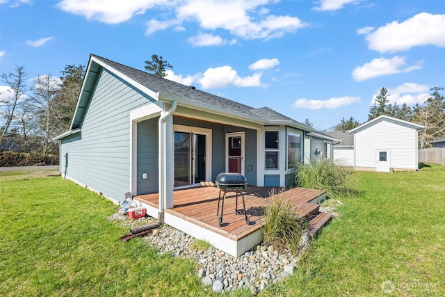 626 Duck Lake Dr SE, Ocean Shores, WA 98569 - rear view of house with a deck and a yard