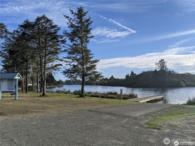 626 Duck Lake Dr SE, Ocean Shores, WA 98569 - water view featuring a boat ramp and a dock