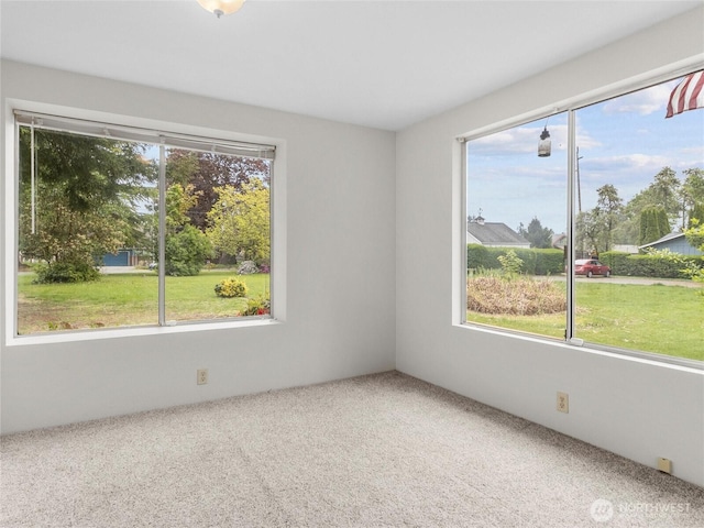 12120 A St S, Tacoma, WA 98444 - empty room featuring healthy amount of natural light and carpet flooring