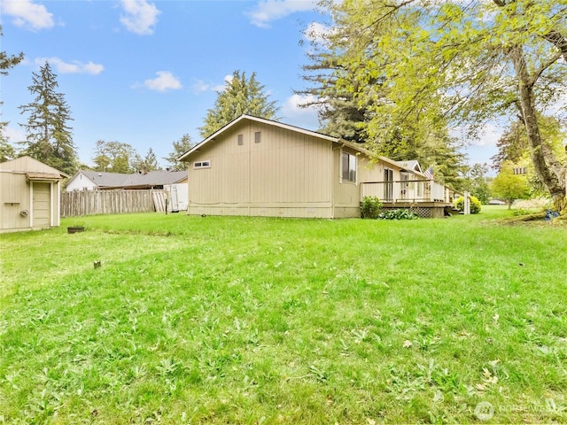 12120 A St S, Tacoma, WA 98444 - view of yard featuring a wooden deck and an outbuilding