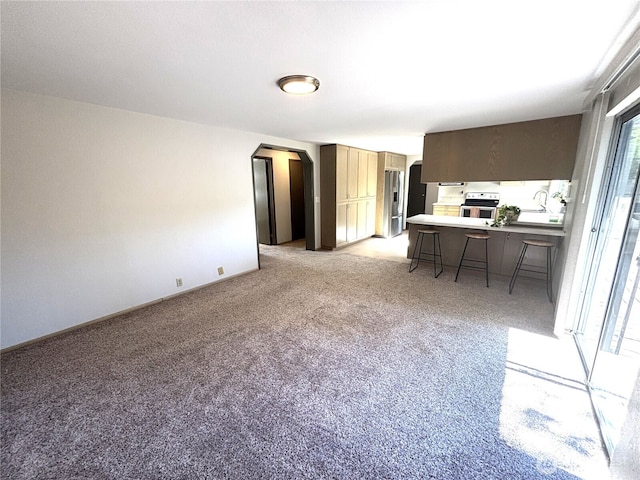 12120 A St S, Tacoma, WA 98444 - living area featuring arched walkways and light colored carpet