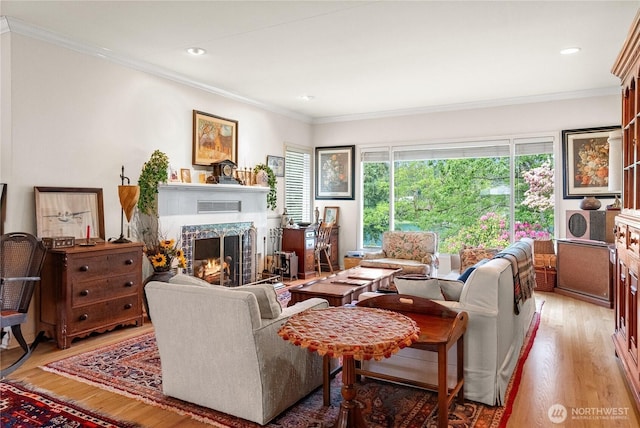 16 Loch Ln SW, Lakewood, WA 98499 - living area featuring light wood-style floors, a premium fireplace, ornamental molding, and recessed lighting