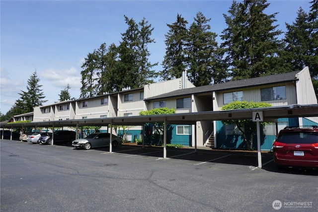 3435 Auburn Way S Unit 15, Auburn, WA 98092 - view of property featuring covered parking