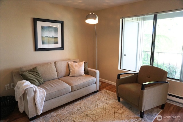 3435 Auburn Way S Unit 15, Auburn, WA 98092 - living area featuring light wood finished floors, baseboards, and a baseboard heating unit